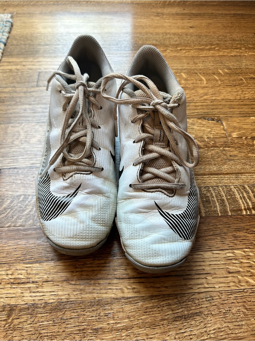 Nike Kids White Cleats with Black Swoosh